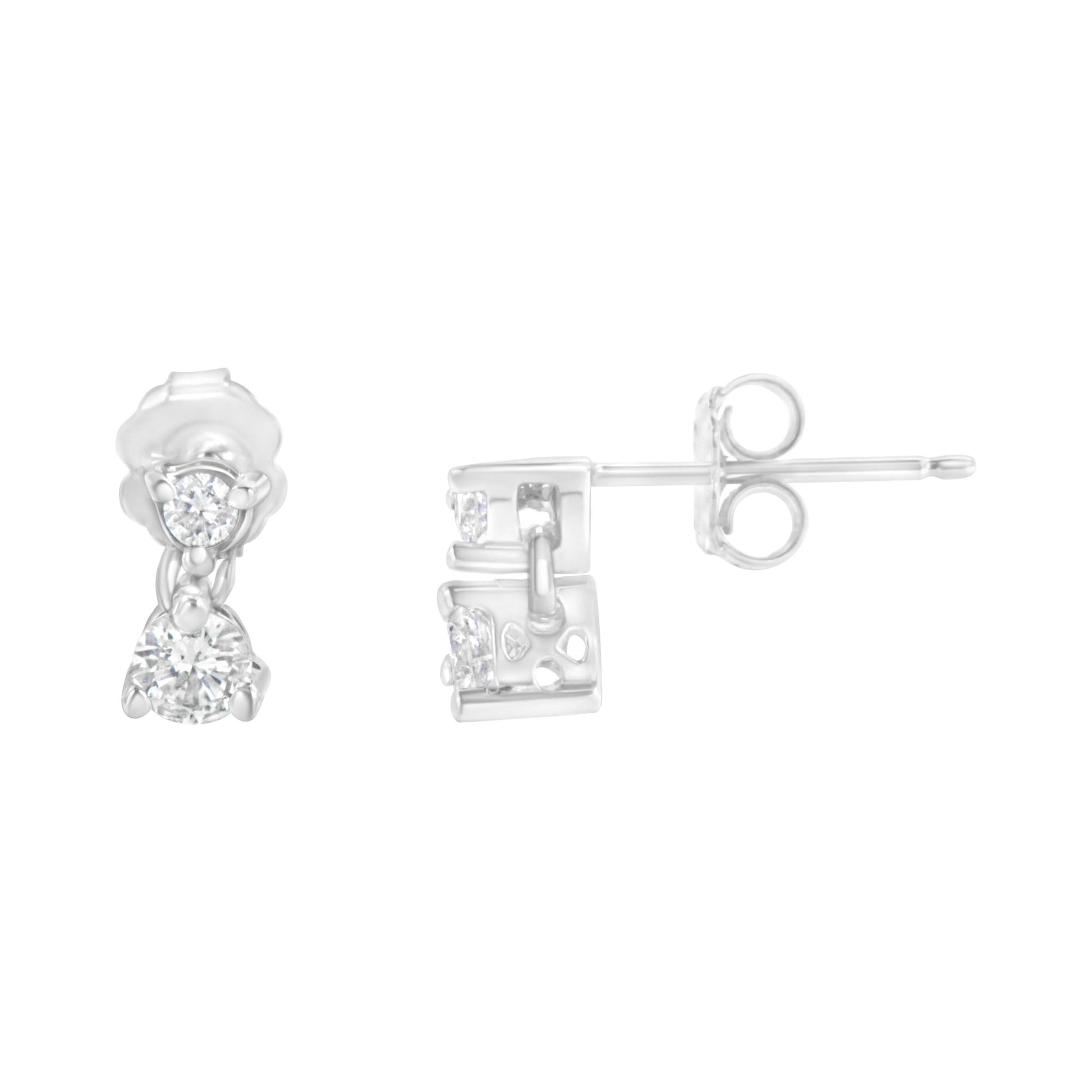 Pair of white metal earrings with round white gemstones in prong settings, shown from front and side angles on a white background.
