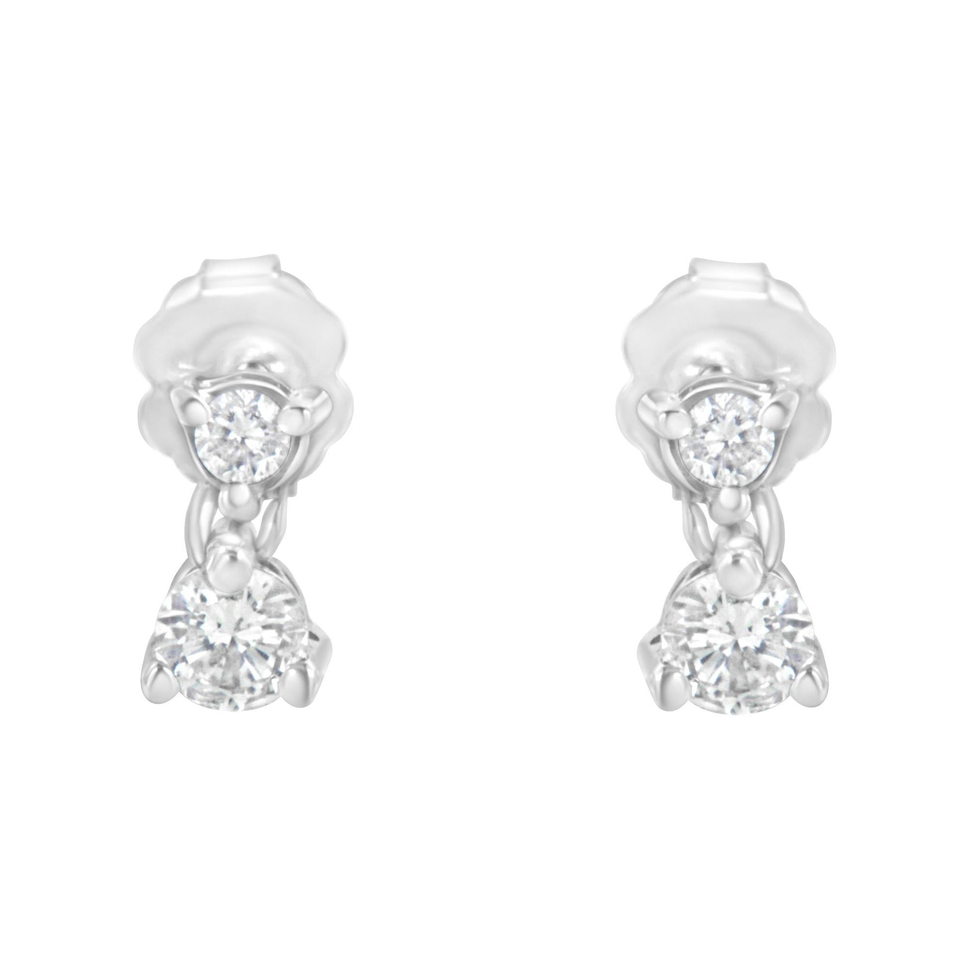 Front view of a pair of white metal earrings each featuring two round white gemstones in prong settings.