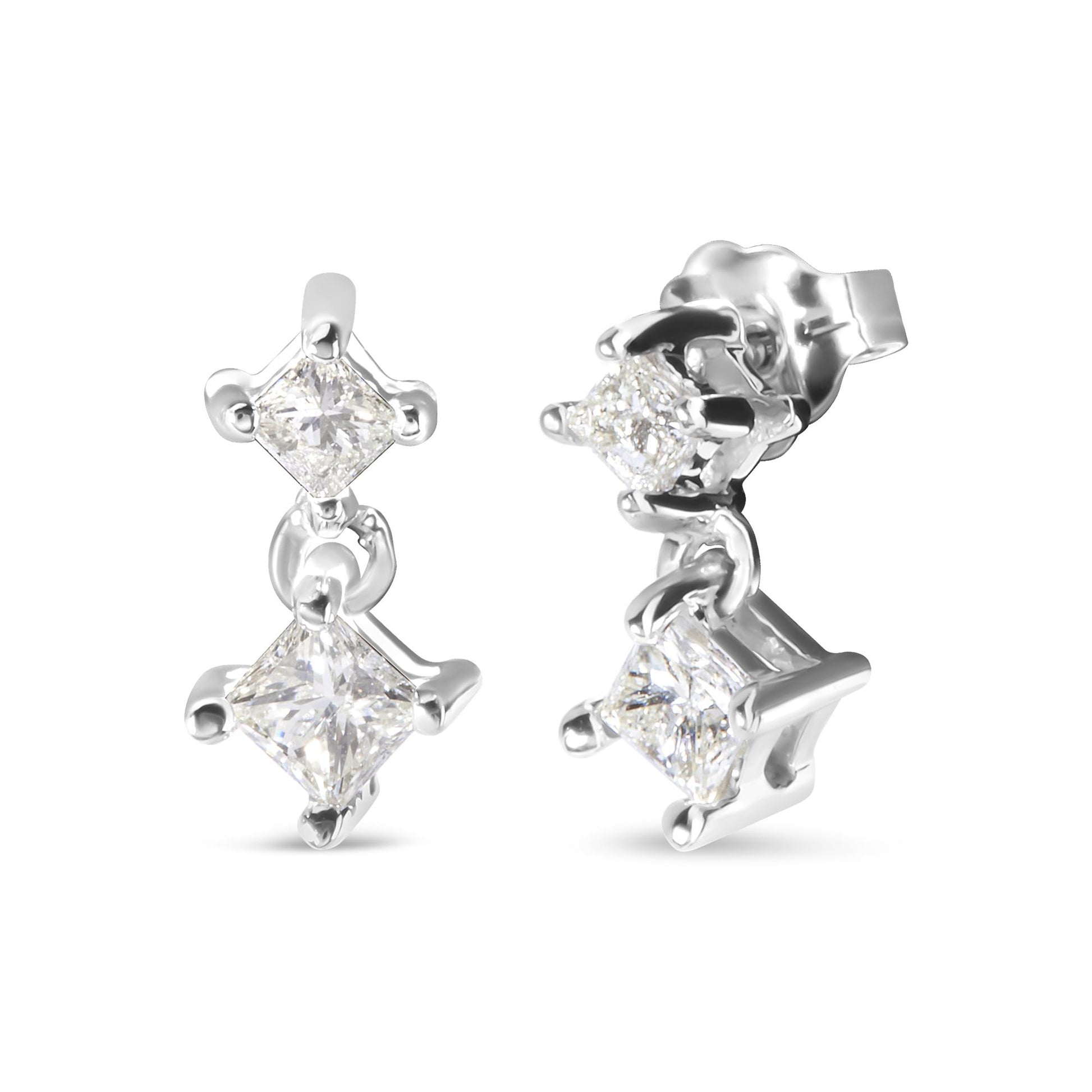 Close-up image of white metal earrings with two hanging princess-shaped white gemstones in prong settings, shown from front and side angles.