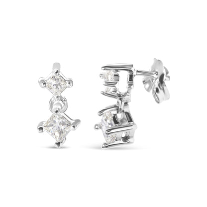 Front and side angle view of white metal earrings featuring two princess-shaped white gemstones in prong settings.
