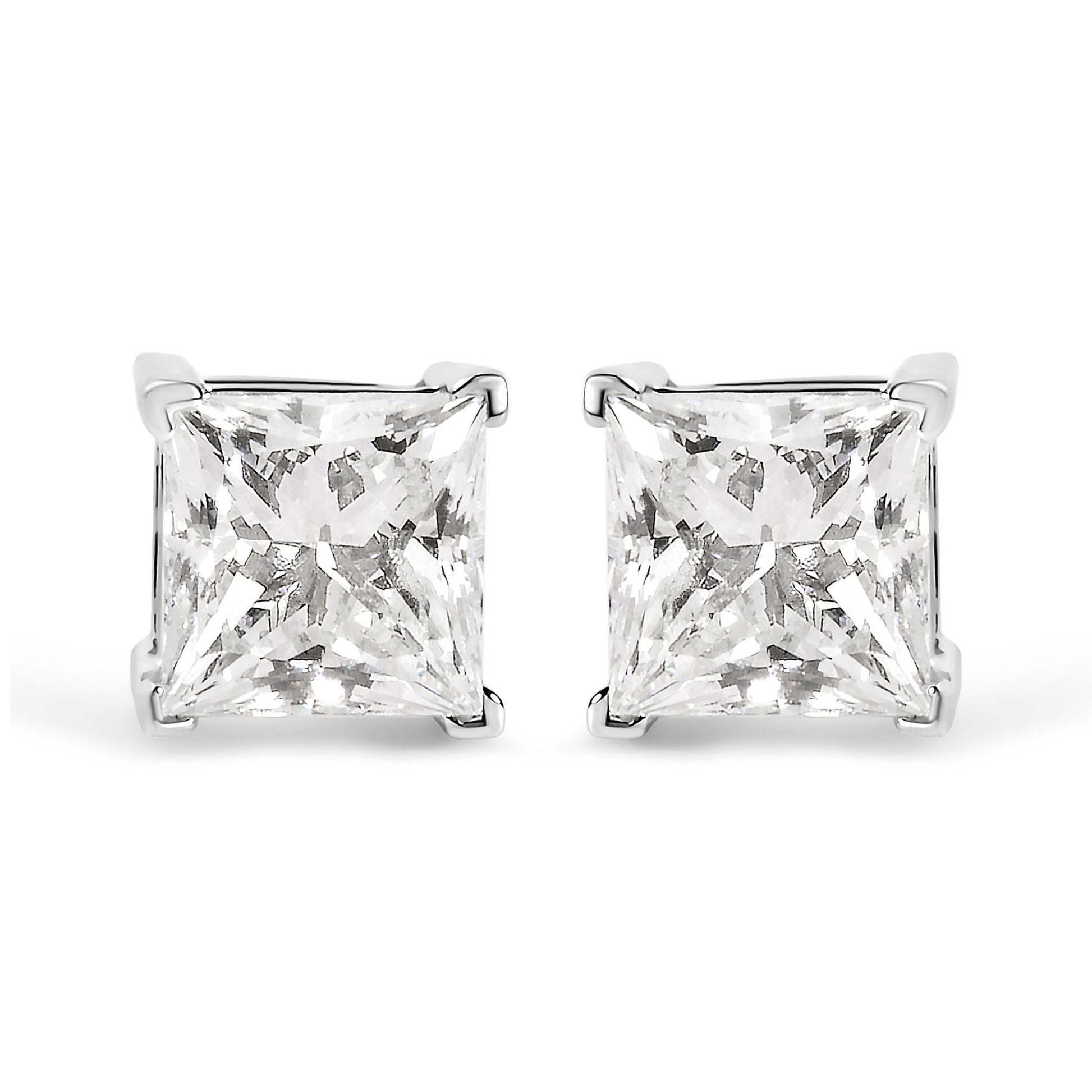 Front view of white metal stud earrings with princess-shaped white gemstones in four-prong settings.