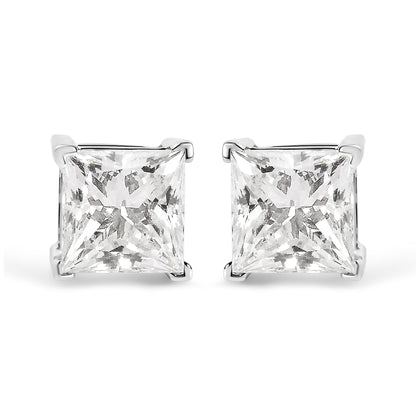 Front view of white metal stud earrings with princess-shaped white gemstones in four-prong settings.