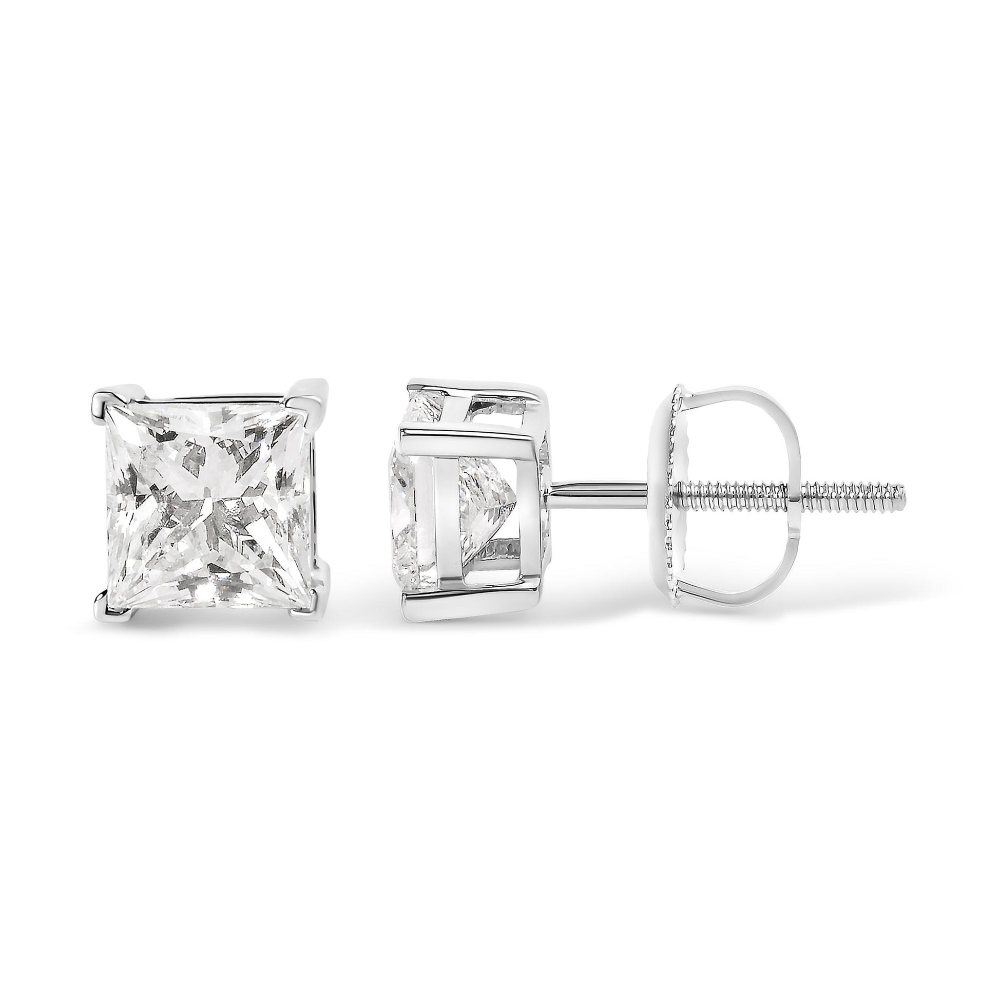 Close-up front and side view of white metal stud earrings with princess shape red gemstones in 4-prong settings.