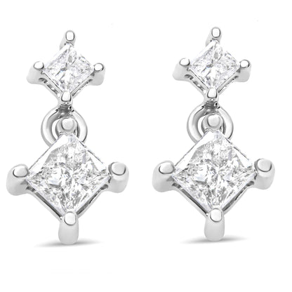 Pair of white metal earrings with two prong-set princess-shaped white gemstones each, shown in a front angle.