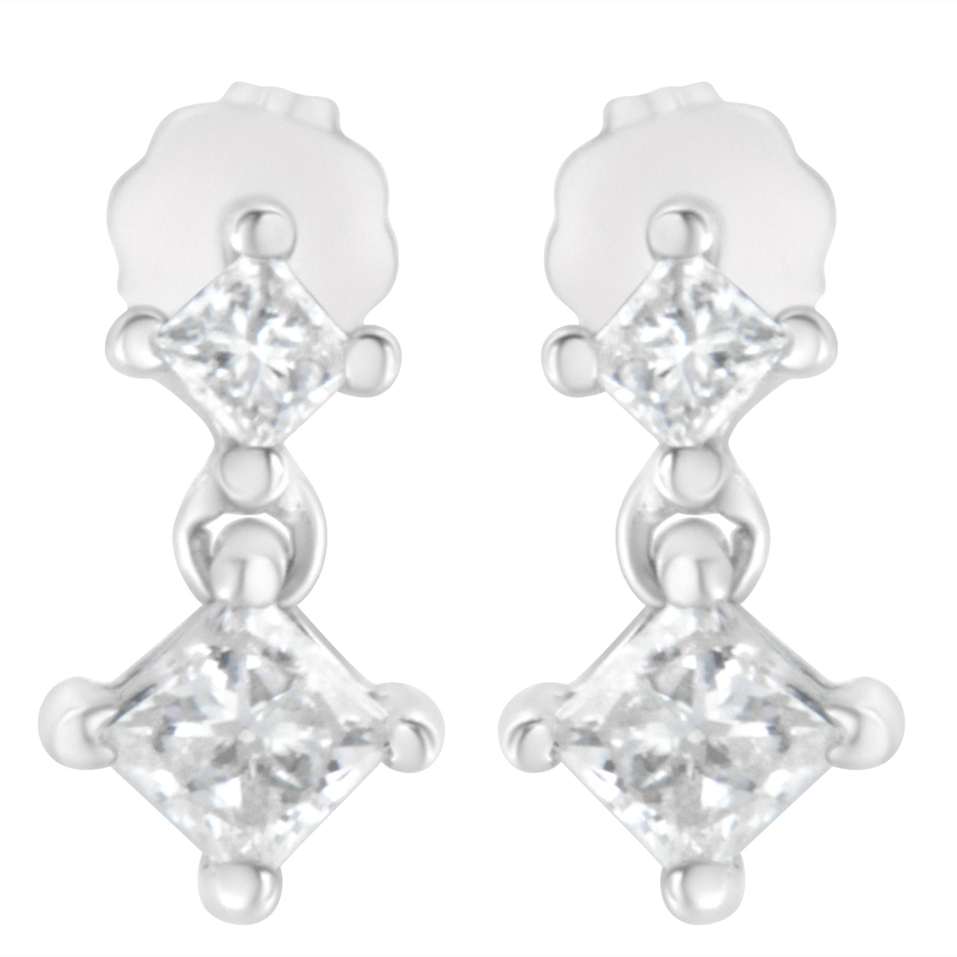 Front view of white metal earrings each featuring two princess-shaped white gemstones in prong settings connected vertically.