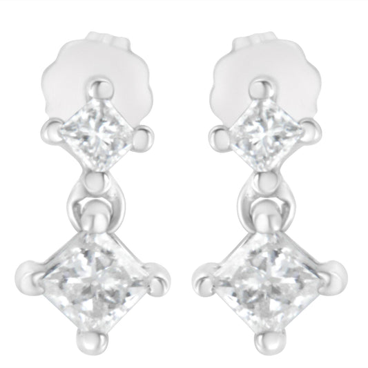 Front view of white metal earrings each featuring two princess-shaped white gemstones in prong settings connected vertically.