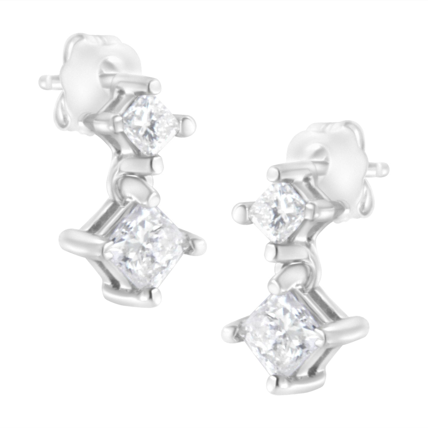 Close-up front angle of white metal earrings with two prong-set princess-shaped white gemstones on each earring.