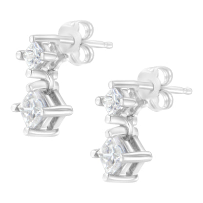 Pair of white metal earrings with two princess-shaped white gemstones each in prong settings, shown from a front angled view.