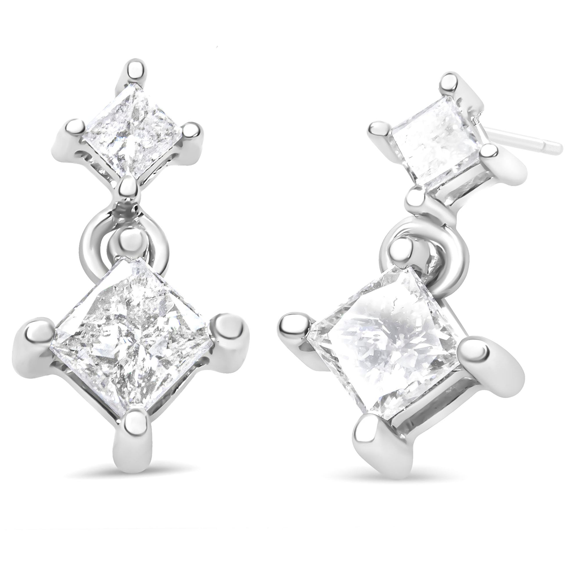 Pair of white metal earrings with two prong-set princess-shaped white gemstones each, shown at a slight angle on a white background.