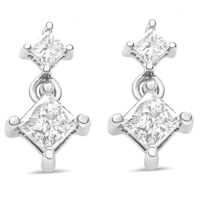 Front view of a pair of white metal earrings each featuring two princess-shaped white gemstones in prong settings.
