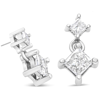 Pair of white metal earrings with two princess-shaped white gemstones each in prong settings, shown from front and side angles.