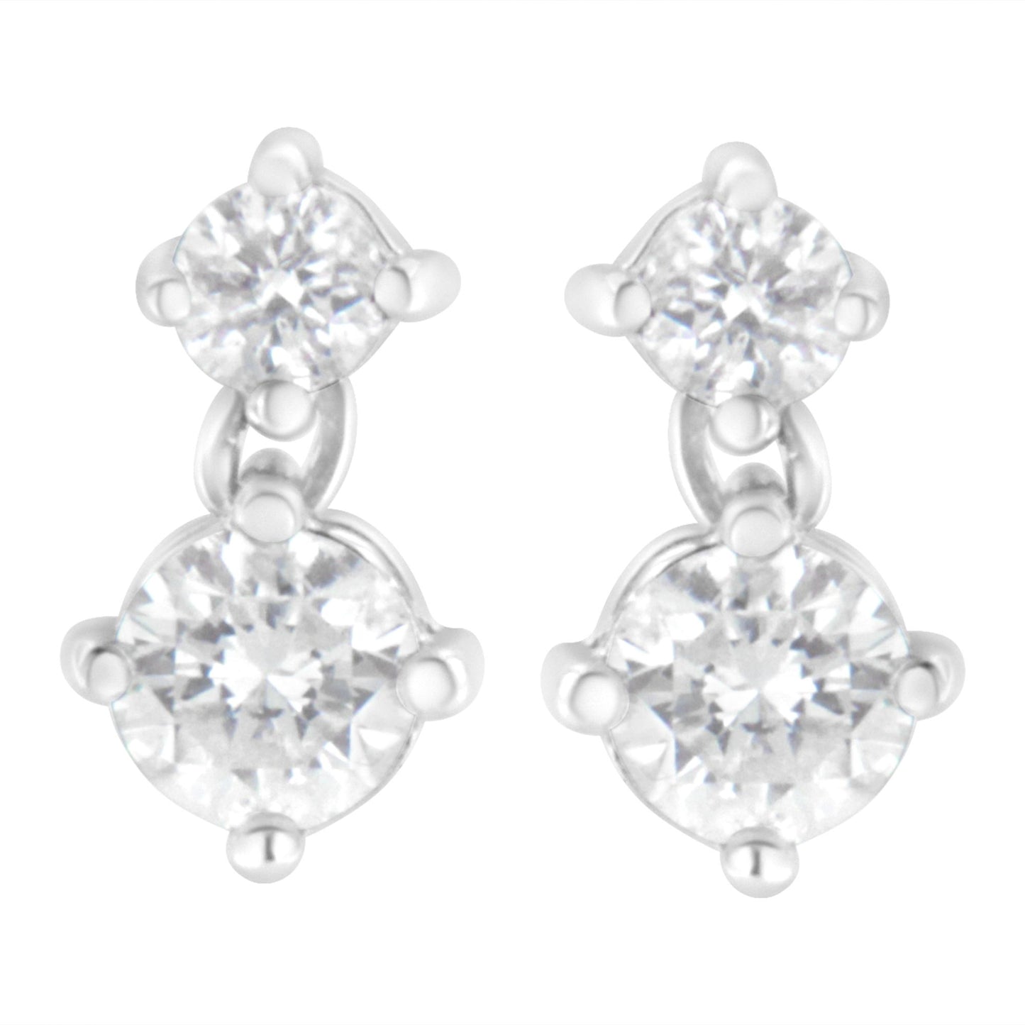 Front angle view of white metal earrings with two round white gemstones each in prong settings.