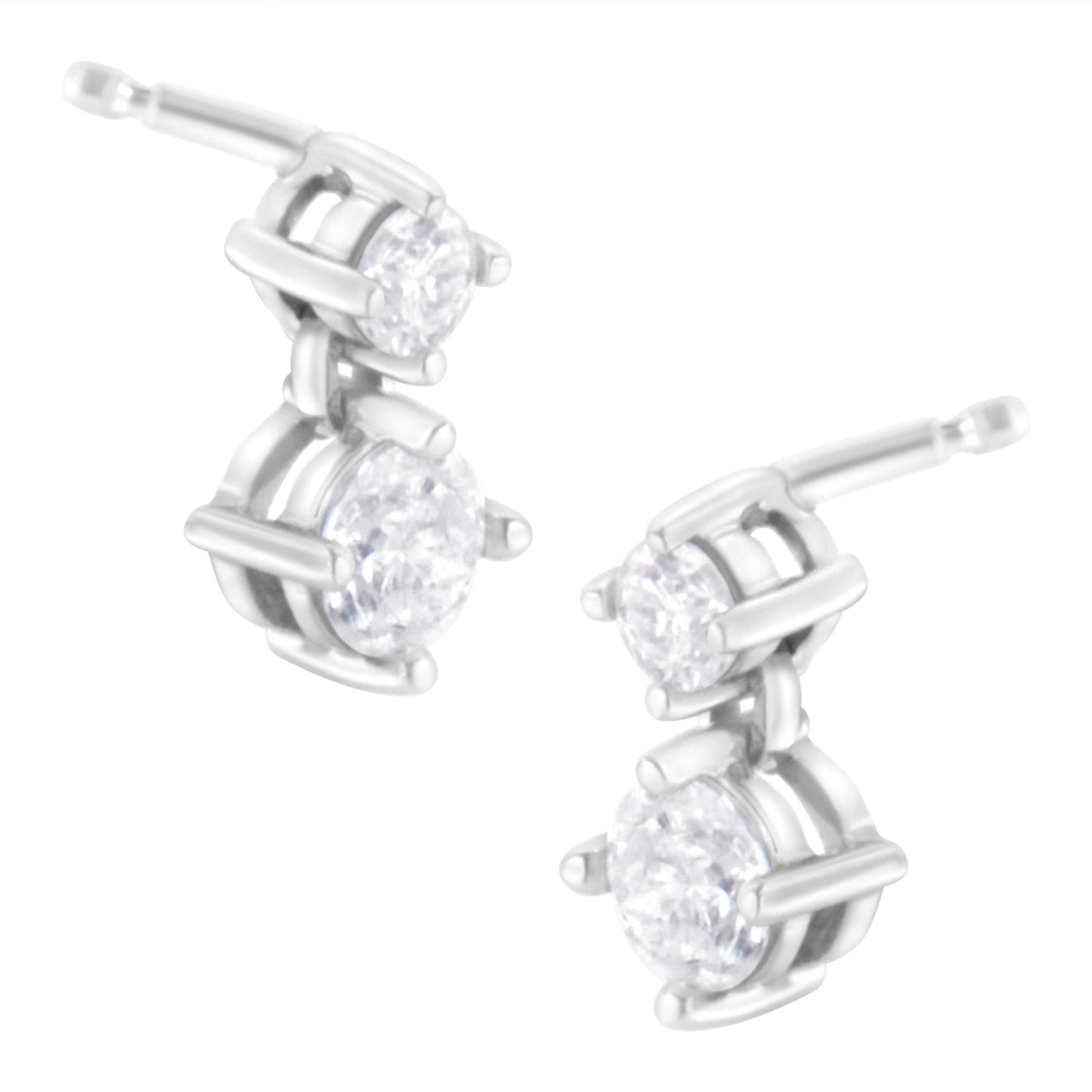 Pair of white metal earrings with two round white gemstones in prong settings, shown from a front angle.