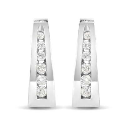 Front view of white metal earrings with channel-set round white gemstones arranged vertically.