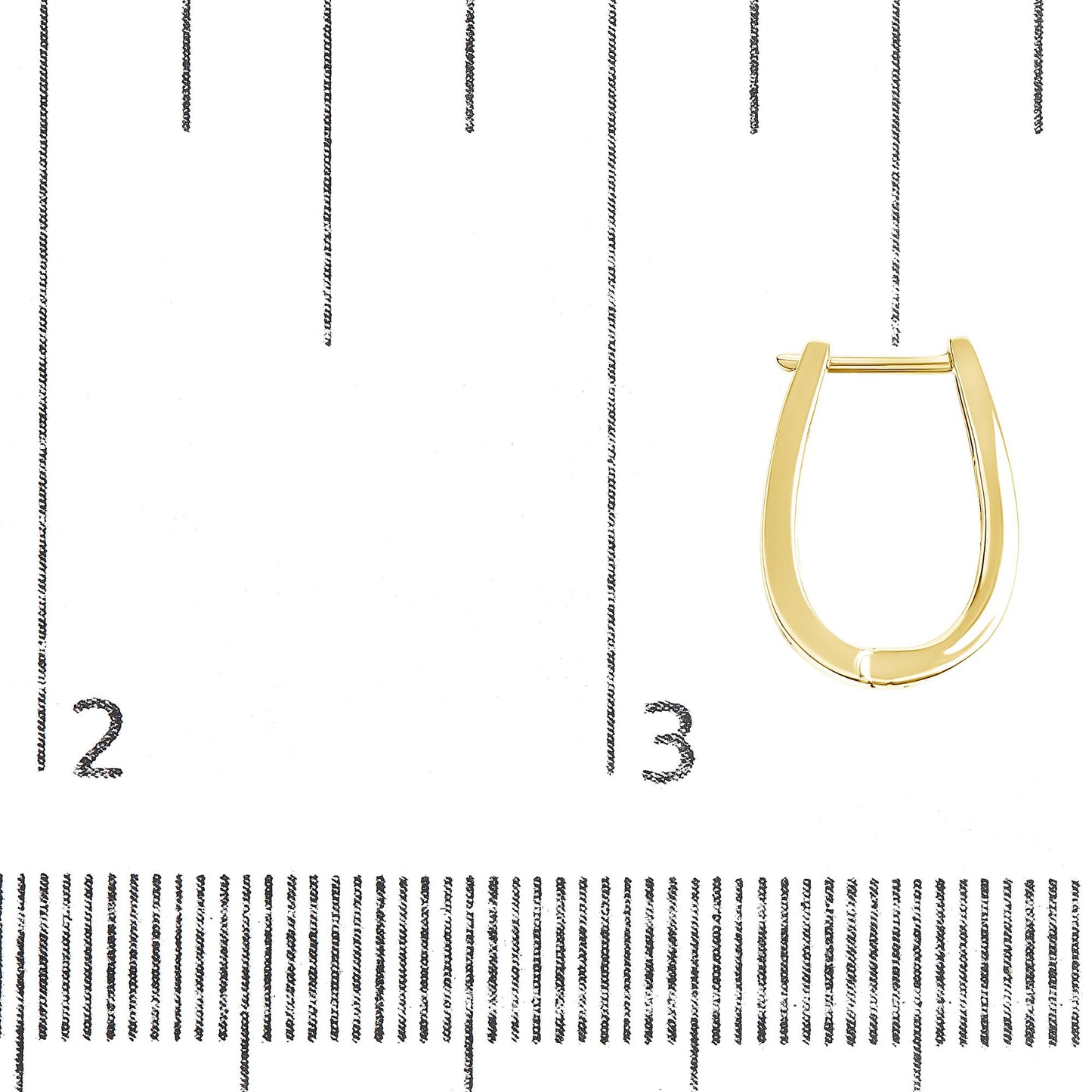Close-up front view of a single yellow metal hoop earring on a ruler for size reference.
