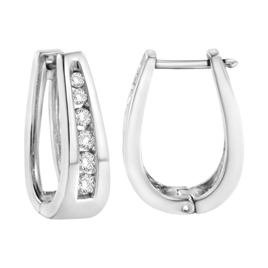 Front and side view of white metal earrings with a row of round white gemstones in channel setting, shot on a white background.