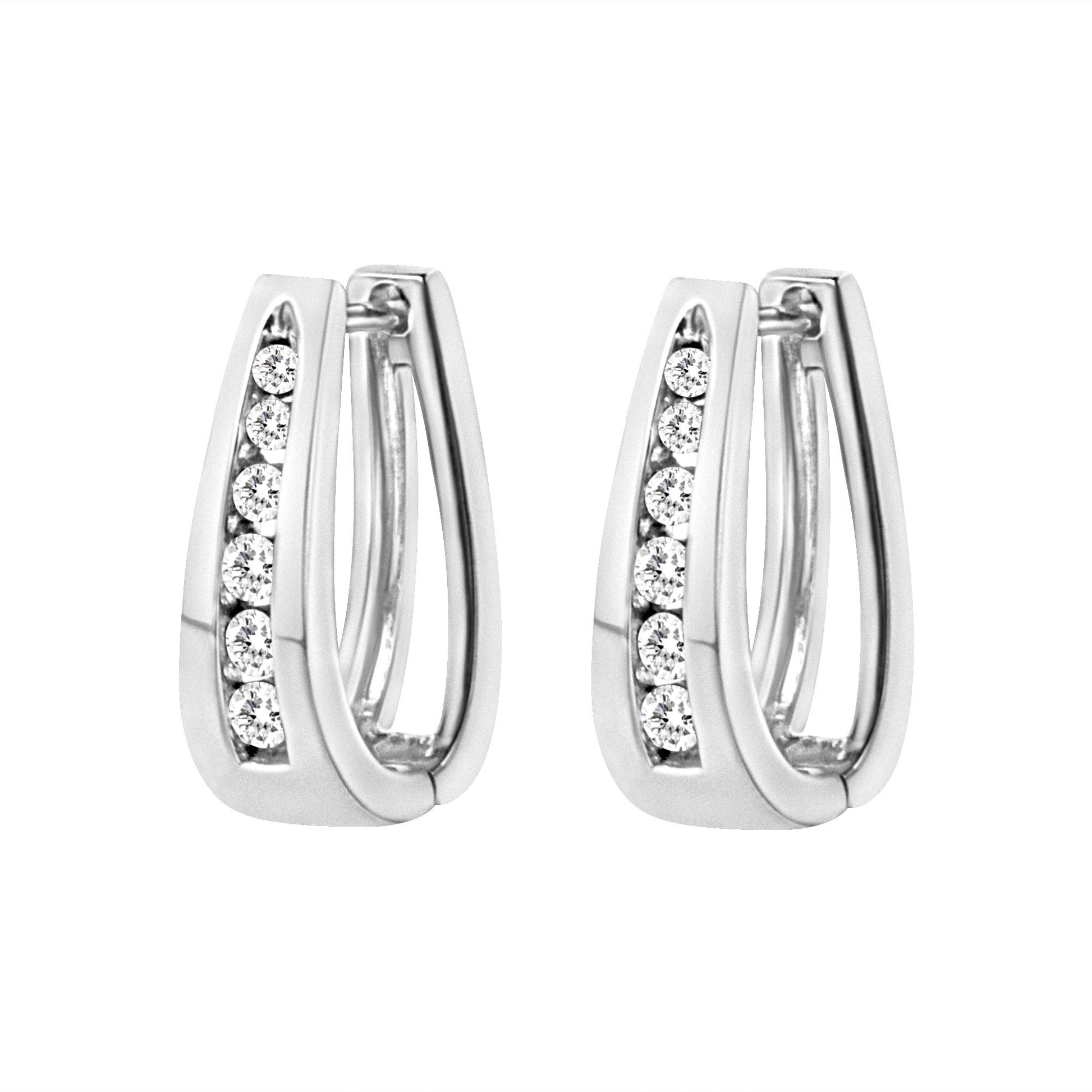 Pair of white metal earrings with channel-set round white gemstones, shown from a front angle.