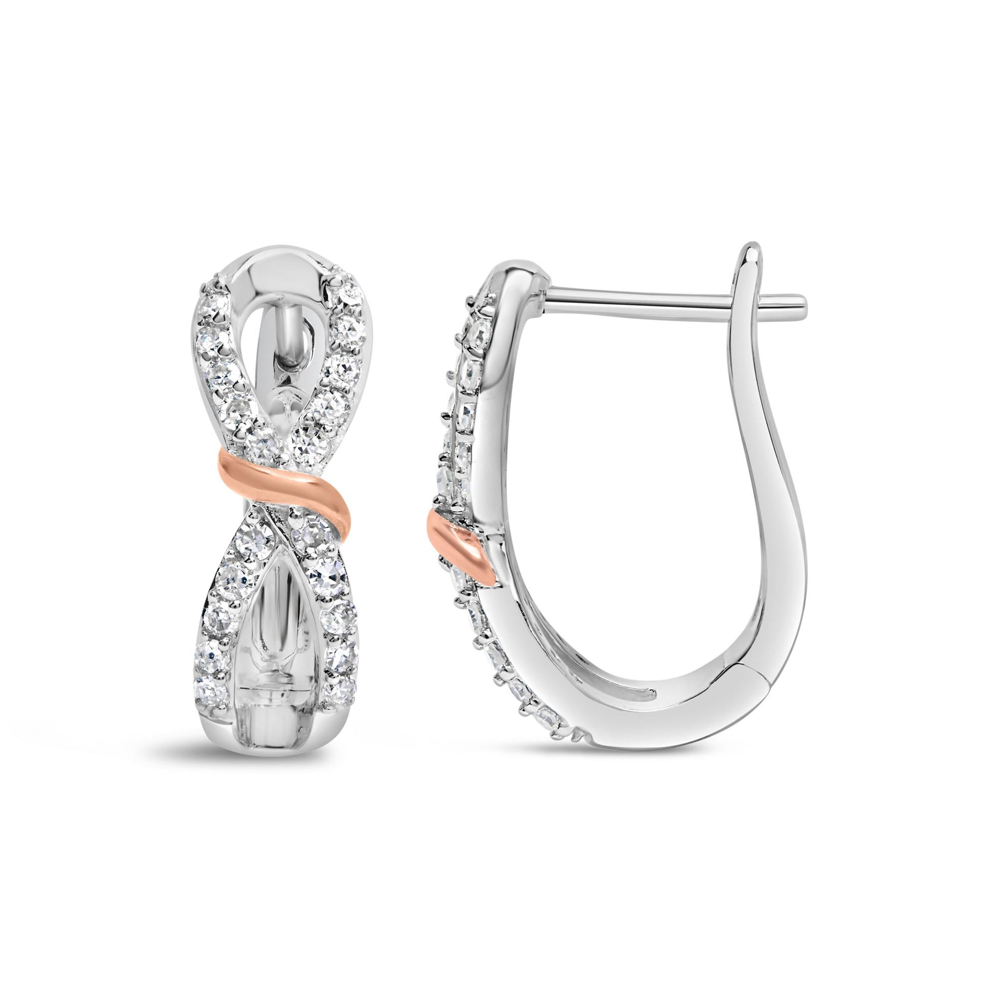Front and side views of white and rose metal earrings with an infinity shape, featuring round white gemstones in prong settings along the front.