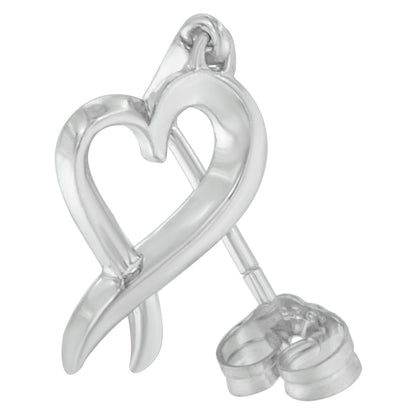 Close-up front angle of a white metal heart-shaped stud earring with a transparent backing.