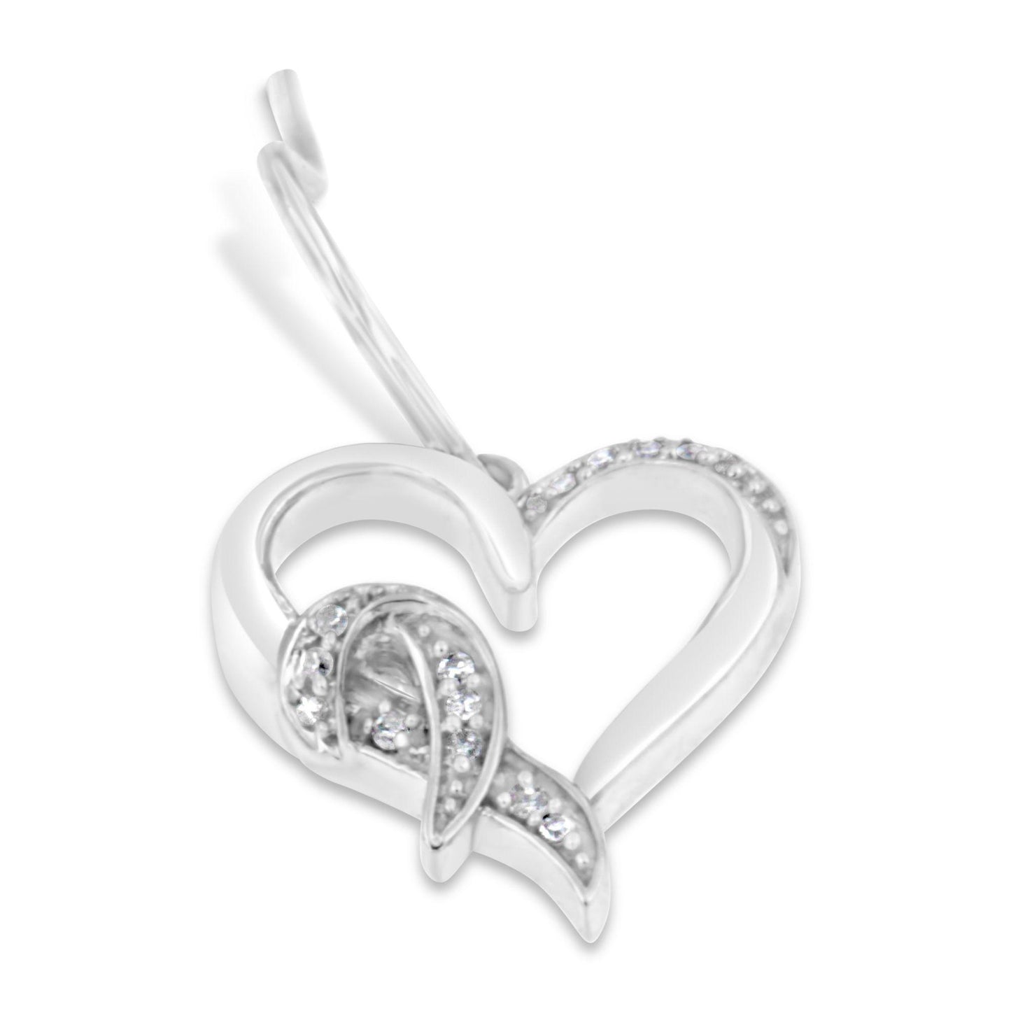 Close-up angled view of a white metal heart-shaped earring with pave-set round white gemstones decorating part of the heart and an additional curved ribbon-like detail inside.