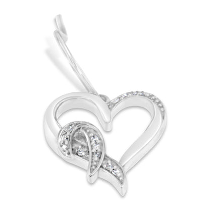 Close-up angled view of a white metal heart-shaped earring with pave-set round white gemstones decorating part of the heart and an additional curved ribbon-like detail inside.