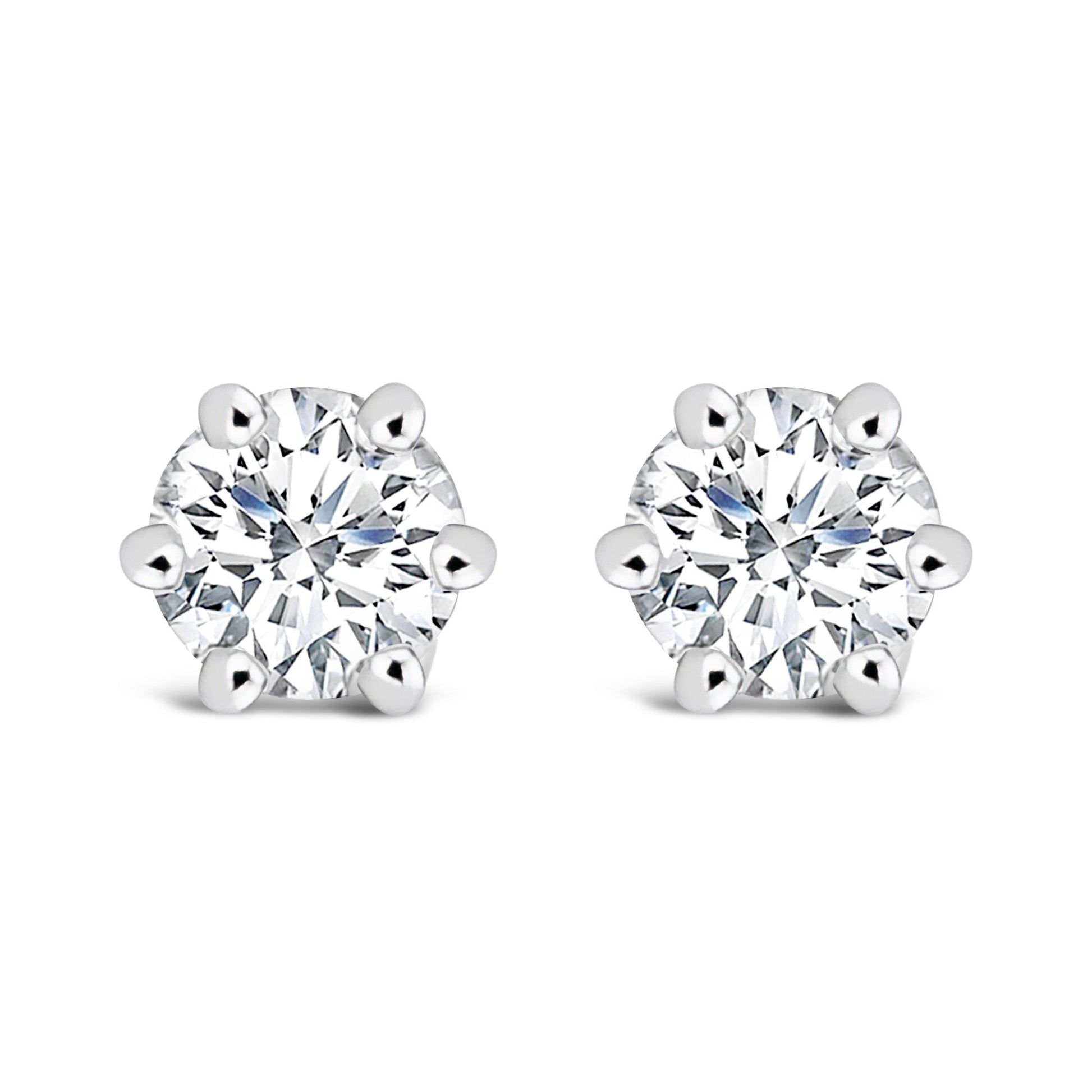 Pair of white metal stud earrings with round white gemstones in six-prong settings, shown from the front on a white background.