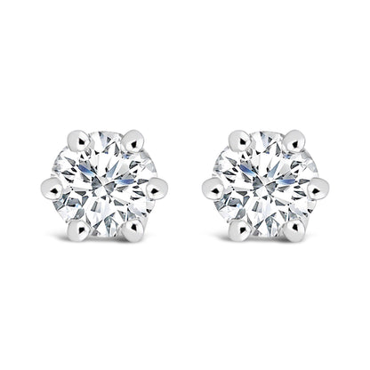 Pair of white metal stud earrings with round white gemstones in six-prong settings, shown from the front on a white background.