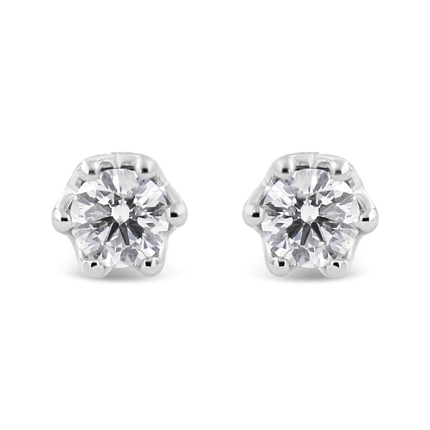 Front view of a pair of white metal stud earrings each featuring a round white gemstone in prong setting.