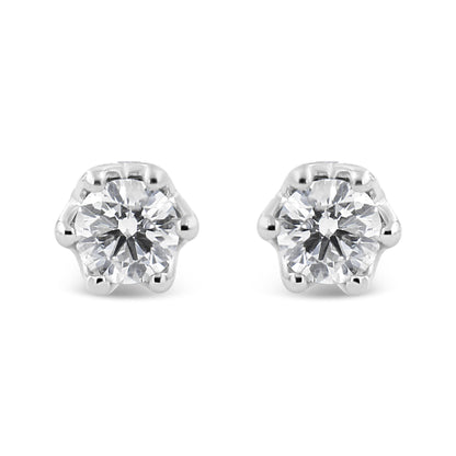 Front view of a pair of white metal stud earrings each featuring a round white gemstone in prong setting.