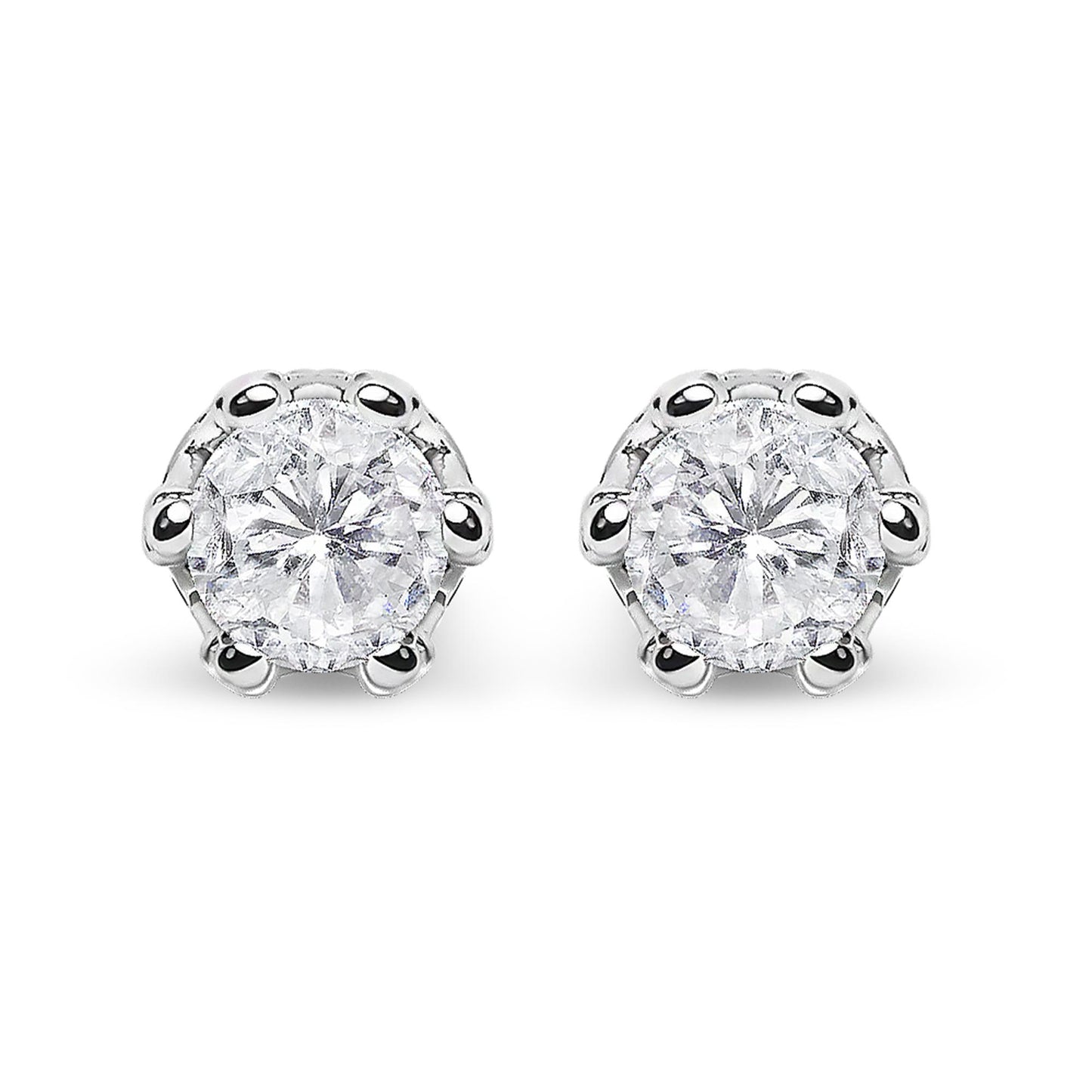 Front-facing close-up of a pair of white metal stud earrings featuring round white gemstones in prong settings with smaller round white gemstones in pave settings above.
