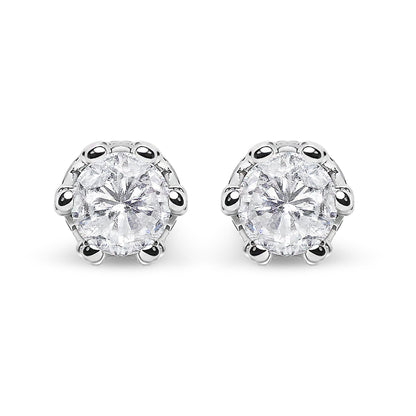 Front-facing close-up of a pair of white metal stud earrings featuring round white gemstones in prong settings with smaller round white gemstones in pave settings above.
