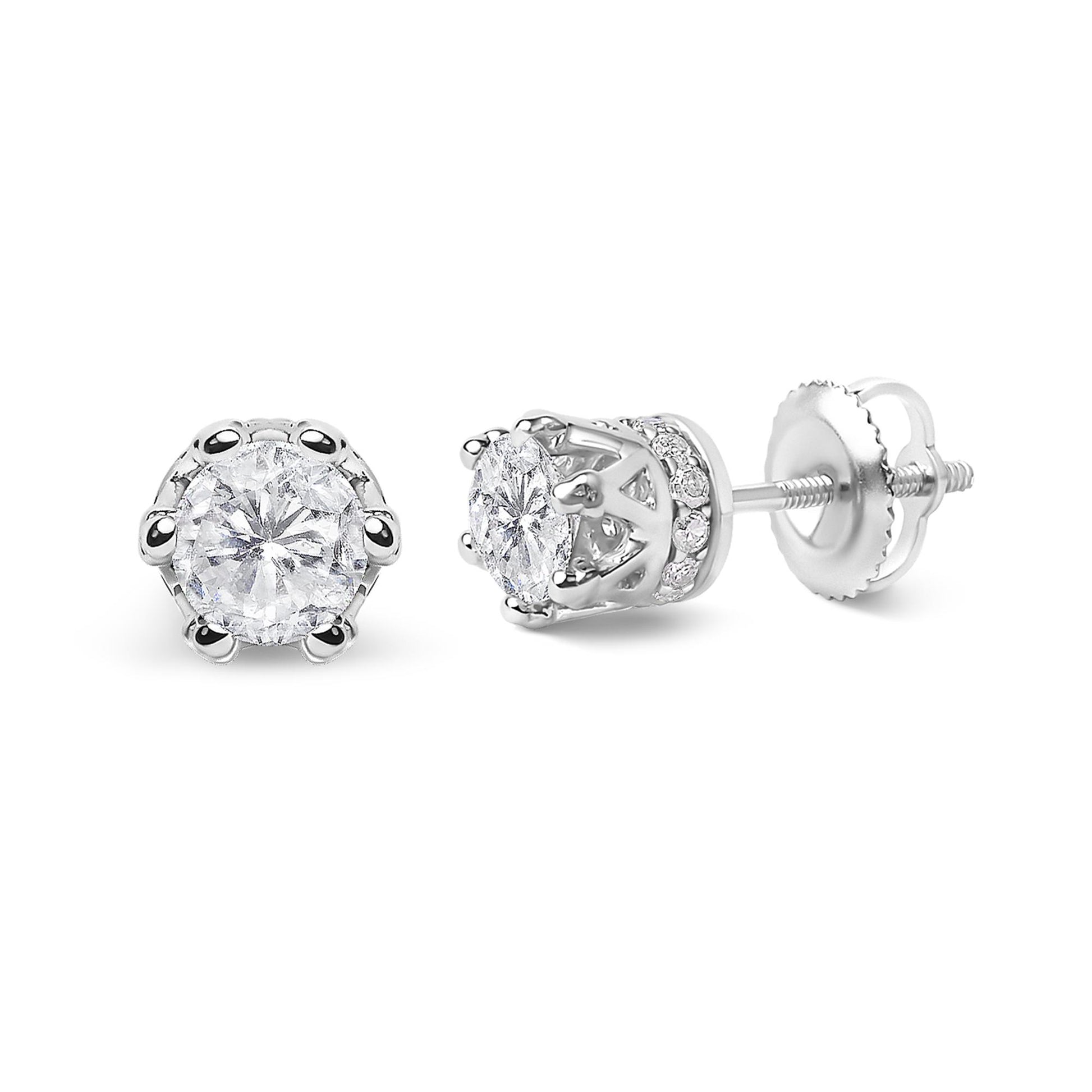 Close-up front and side view of white metal stud earrings featuring a round white gemstone in prong setting, surrounded by small round white gemstones in pave setting.