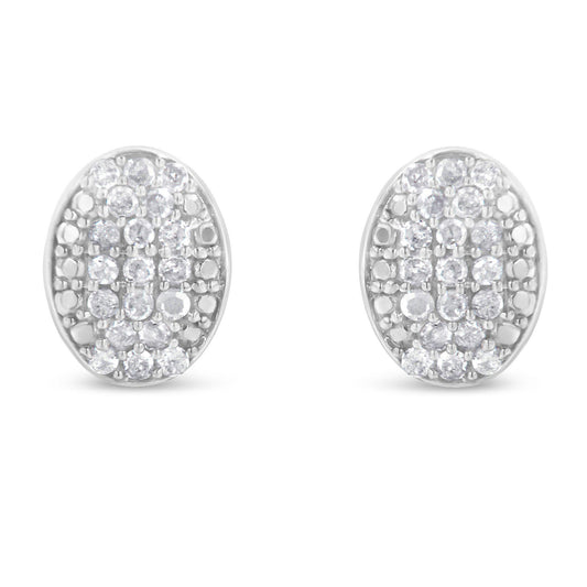 Front-facing view of a pair of white metal oval earrings featuring multiple round white gemstones in prong settings.