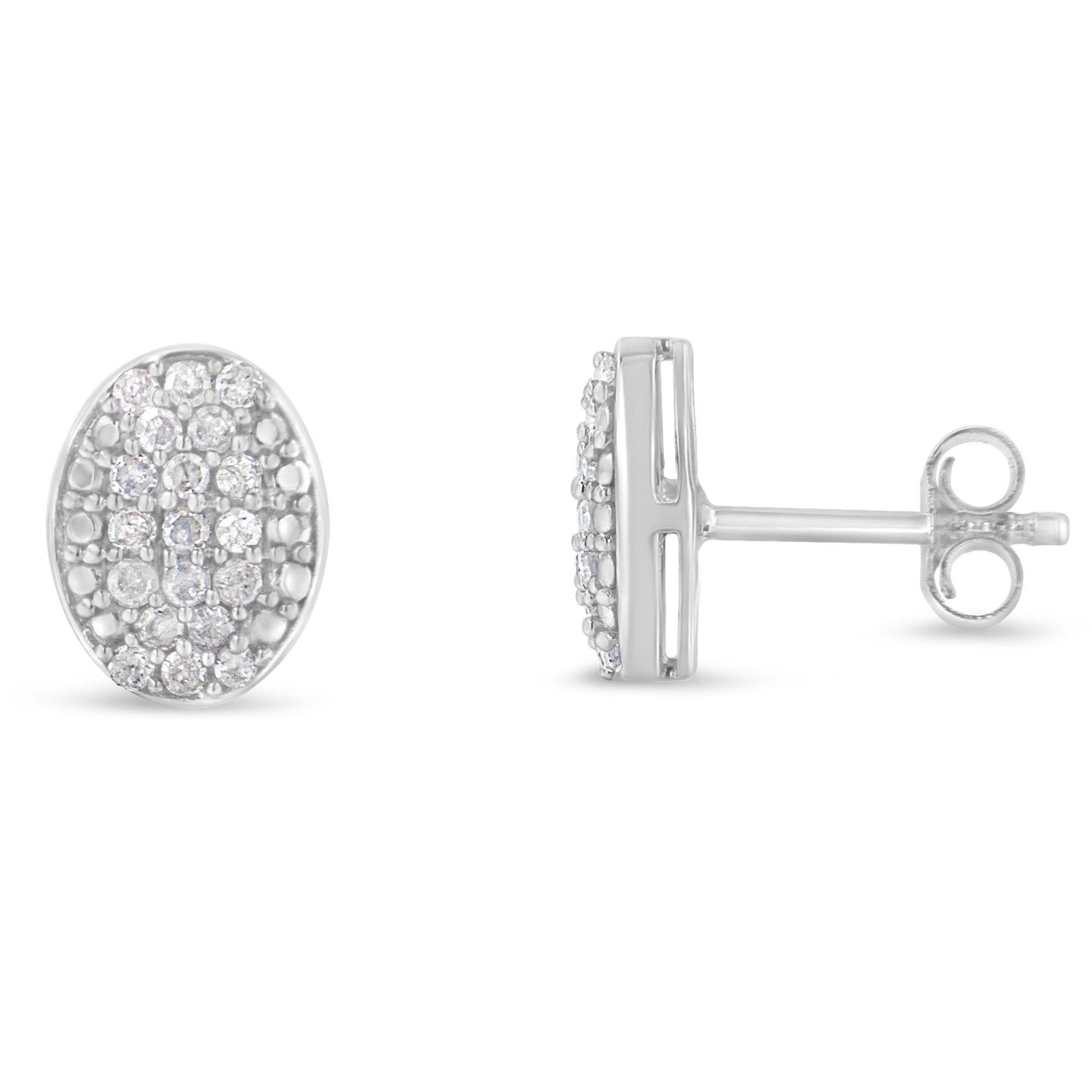 Pair of white metal oval stud earrings with round white gemstones in prong settings, shown from front and side angles.