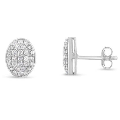 Pair of white metal oval stud earrings with round white gemstones in prong settings, shown from front and side angles.