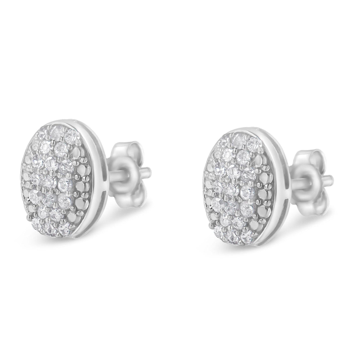 Pair of white metal oval stud earrings with multiple round white gemstones in prong settings, shown from a front-side angle.