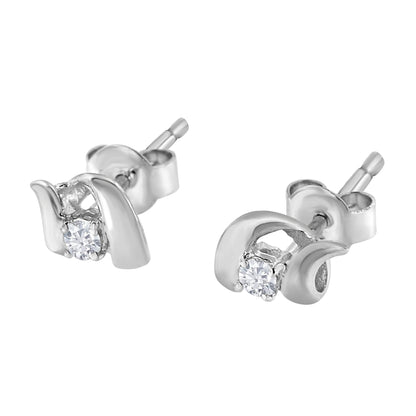 Pair of white metal stud earrings with a round white gemstone in prong setting, shown from a front angle.