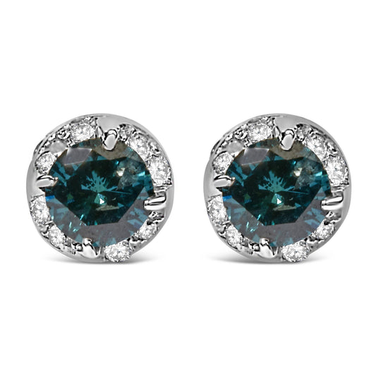 Front-facing view of white metal stud earrings featuring a central blue gemstone in prong setting surrounded by smaller white gemstones in pave setting.