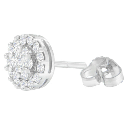 Close-up side angle of a white metal stud earring with round white gemstones in prong settings arranged in a cluster, showing the post and butterfly back.
