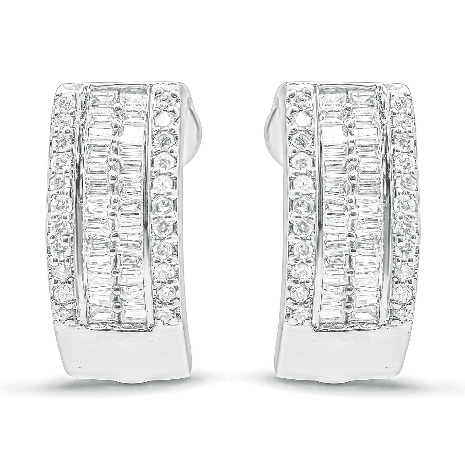 Front-facing shot of white metal earrings featuring rows of round-shaped pave set white gemstones along the edges and channel-set baguette-shaped white gemstones in the center.