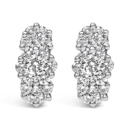 Close-up front view of yellow metal earrings with multiple round white gemstones in prong settings.