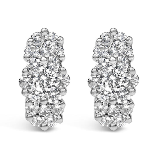 Close-up front view of yellow metal earrings with multiple round white gemstones in prong settings.