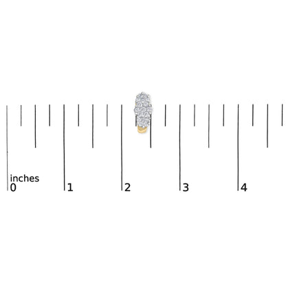 Close-up top view of a yellow metal earring with multiple round white gemstones in prong setting, displayed on a ruler for size reference.