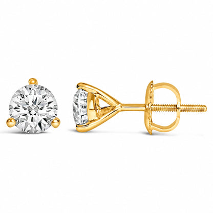 Close-up image of one yellow metal stud earring with a round white gemstone in a 3-prong setting, shown from front and side angles on a white background.
