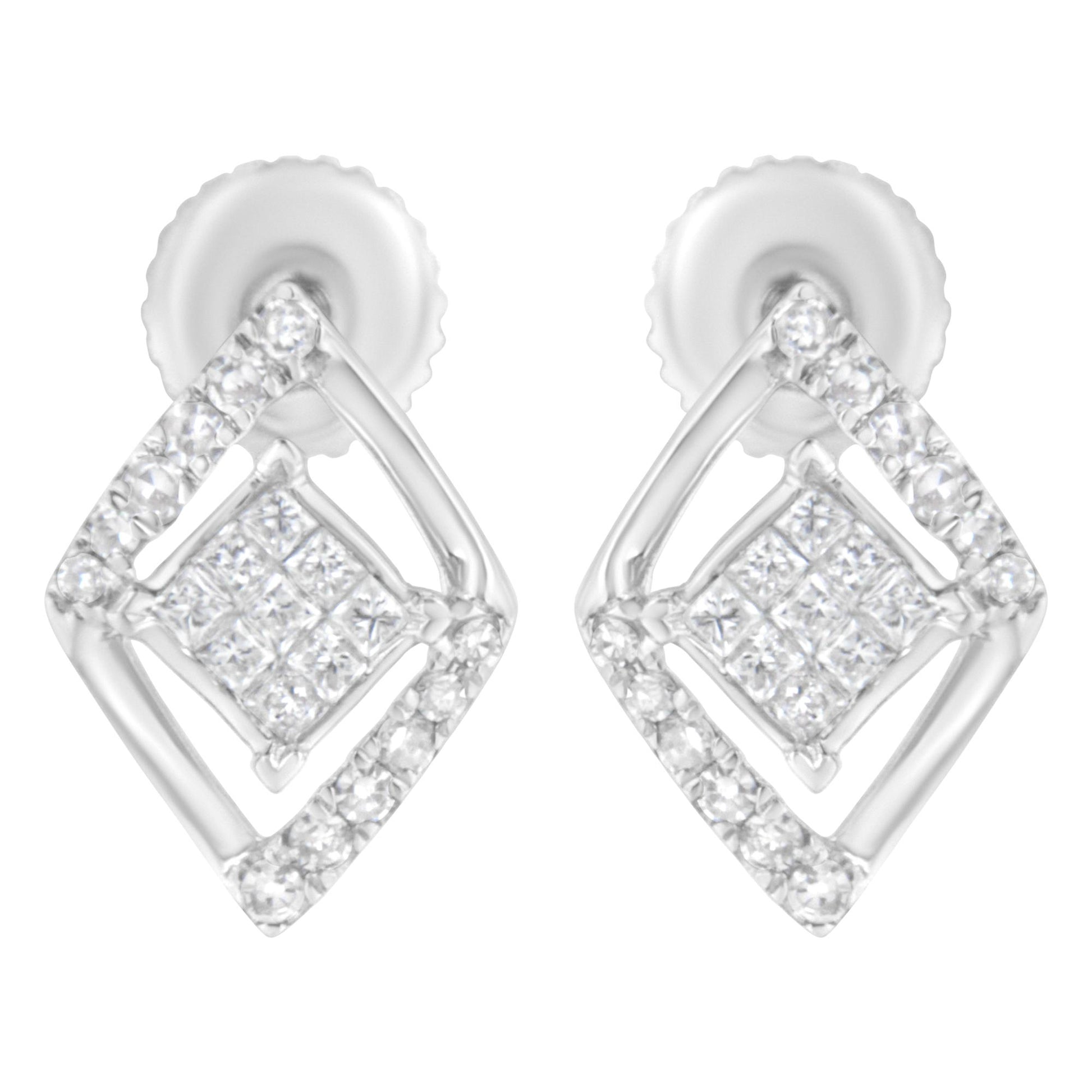 Close-up front view of white metal earrings featuring a geometric design with round prong-set white gemstones outlining a diamond shape and smaller princess-cut invisible-set white gemstones clustered in the center.
