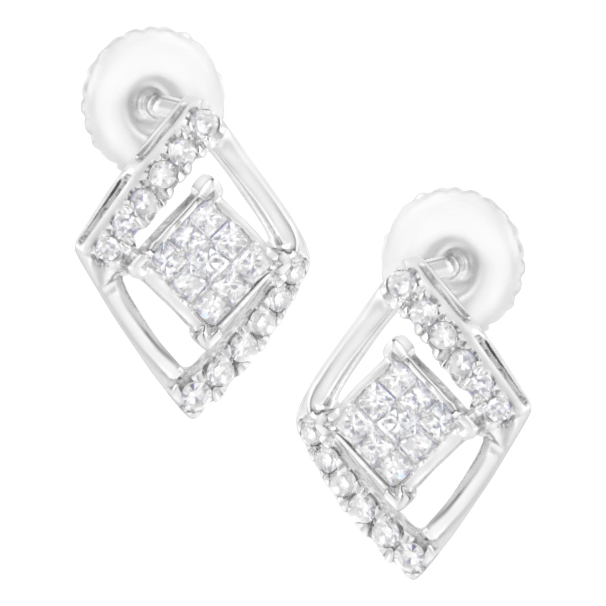 Pair of white metal stud earrings with a square design, featuring round white gemstones in prong settings around the edges and princess-shaped white gemstones in invisible settings in the center, shown at a slight angle.