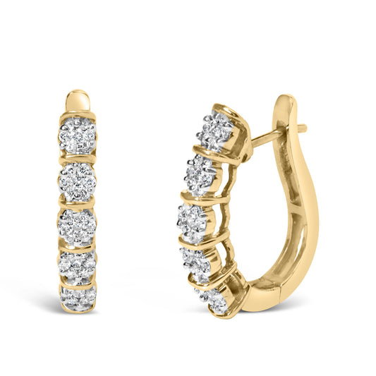 Front and side view of yellow metal hoop earrings set with multiple round white gemstones in prong settings, shown on a white background.