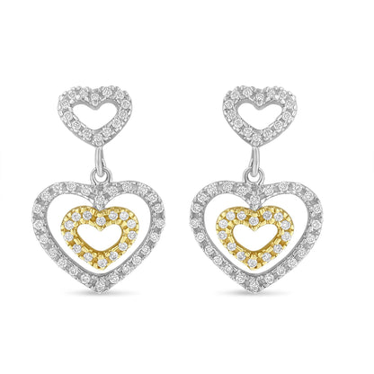 Front view of two-toned heart-shaped dangle earrings with pave-set white round gemstones arranged in three concentric heart outlines.