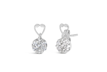 Pair of white metal earrings with round white gemstones in a cluster setting and an open heart detail at the top, shown from a front and angled side view.