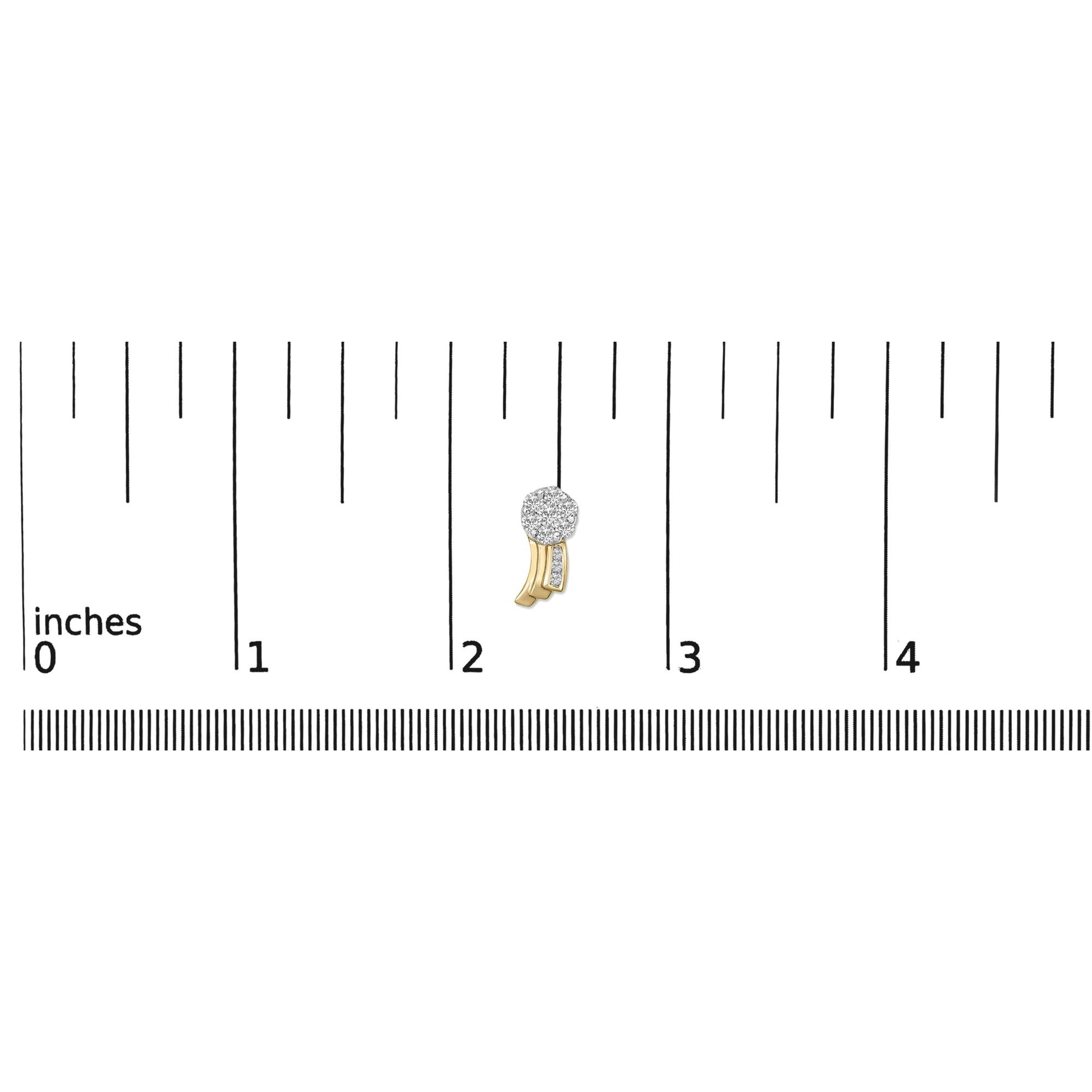 Close-up front view of a yellow metal earring with a cluster of round white gemstones at the top and smaller white gemstones set on a curved part below, placed on a ruler for size reference.
